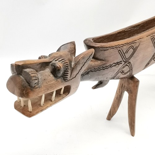 236 - Tribal carved wooden depiction of a mythical creature 90cm long x 35cm high