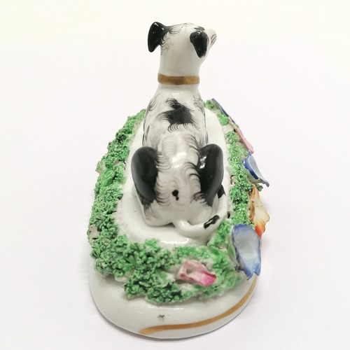 286 - Antique porcelain staffordshire dog figure  with floral detail - 11.5cm across x 6.5cm high ~ losses... 