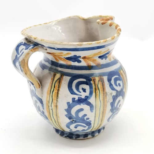 322 - Antique Continental faience / tin glaze jug inscribed Brugghe ~ 12cm high with some frittering to th... 