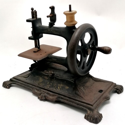 336 - Antique cast iron Continental sewing machine - 28cm x 17cm x 22cm high & obvious signs of use / wear