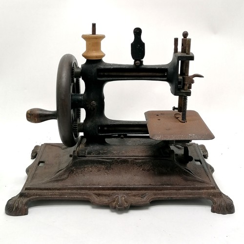 336 - Antique cast iron Continental sewing machine - 28cm x 17cm x 22cm high & obvious signs of use / wear