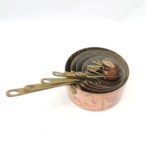 339 - Graduated set of copper & brass handled saucepans - largest 20.5cm diameter & smallest 3.5cm diamete... 