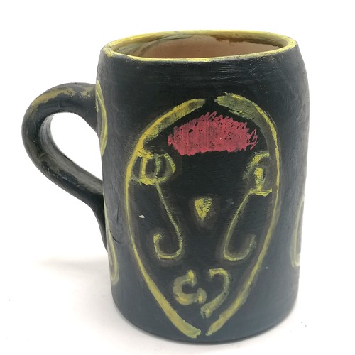 2 - Studio pottery hand painted tankard with face detail signed JP - 12.5cm high - 1 small paint loss wi... 