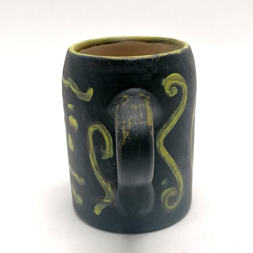 2 - Studio pottery hand painted tankard with face detail signed JP - 12.5cm high - 1 small paint loss wi... 