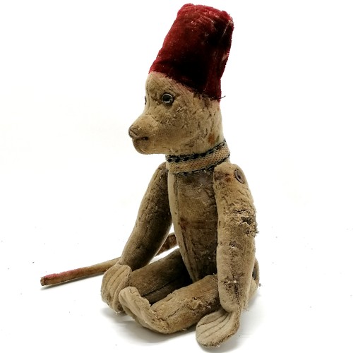 4 - Antique toy jointed monkey wearing a fez style hat & has leather button eyes - 40cm tall and obvious... 