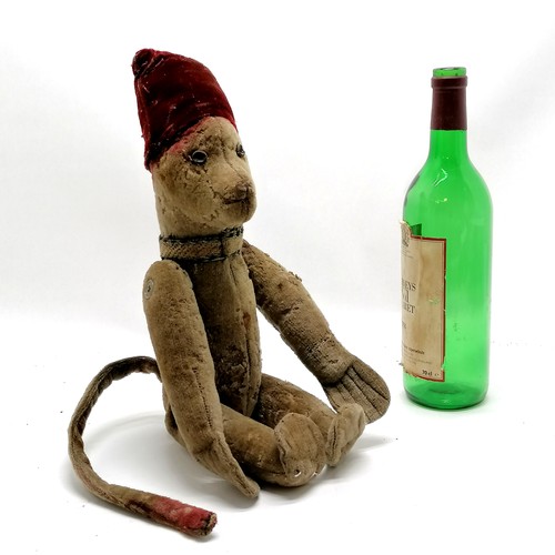 4 - Antique toy jointed monkey wearing a fez style hat & has leather button eyes - 40cm tall and obvious... 