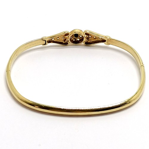 424 - 14ct marked gold sapphire / white stone set bangle - 6cm across & 7.9g total weight - SOLD ON BEHALF... 