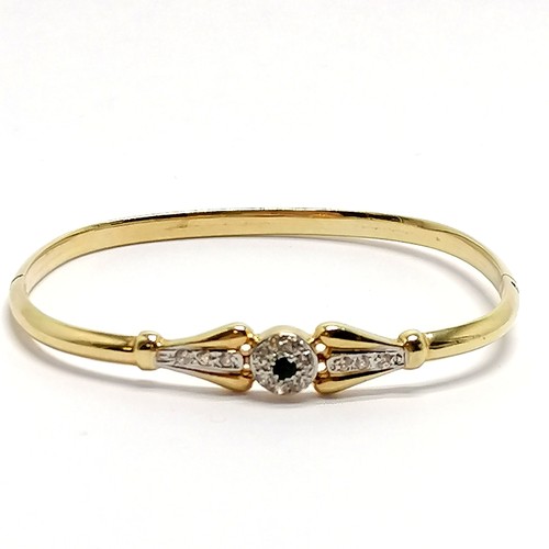 424 - 14ct marked gold sapphire / white stone set bangle - 6cm across & 7.9g total weight - SOLD ON BEHALF... 