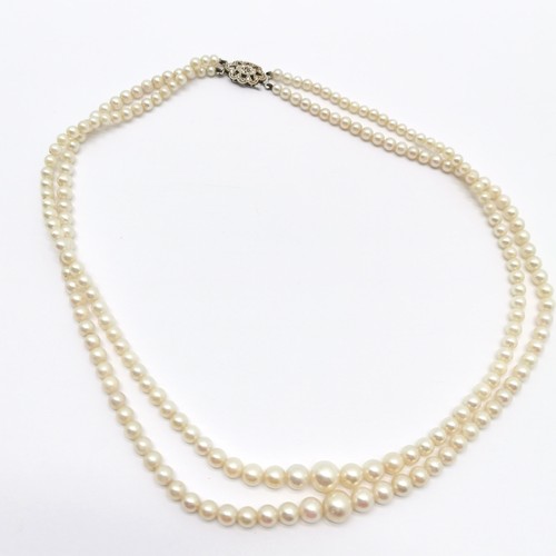 499 - Double graduated strand of pearls with 9ct white gold clasp - 40cm long