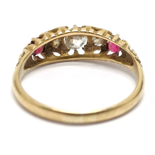 528 - Antique gold (touch tests as 18ct) ruby / diamond 5 stone ring - size N & 2.3g total weight ~ centre... 