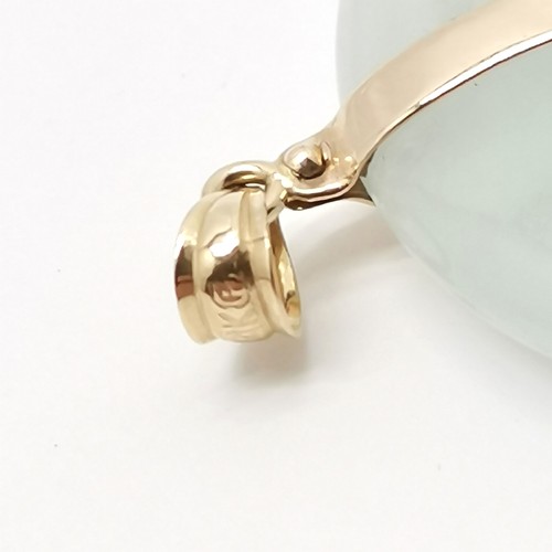 531 - Chinese 14ct gold mounted jade bi pendant - 3.4cm diameter & 17.1g total weight