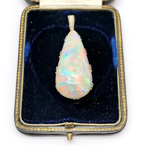 541 - Antique large opal pendant set in unmarked 18ct gold with diamond set bale (4cm drop & 6.4g total we... 