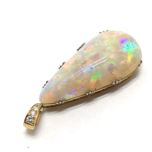 541 - Antique large opal pendant set in unmarked 18ct gold with diamond set bale (4cm drop & 6.4g total we... 