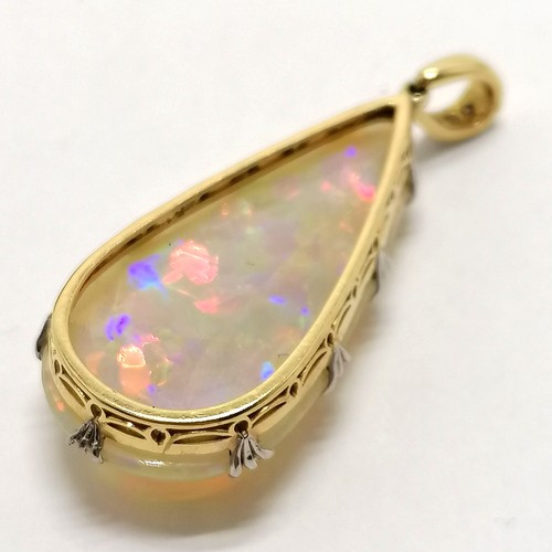 541 - Antique large opal pendant set in unmarked 18ct gold with diamond set bale (4cm drop & 6.4g total we... 