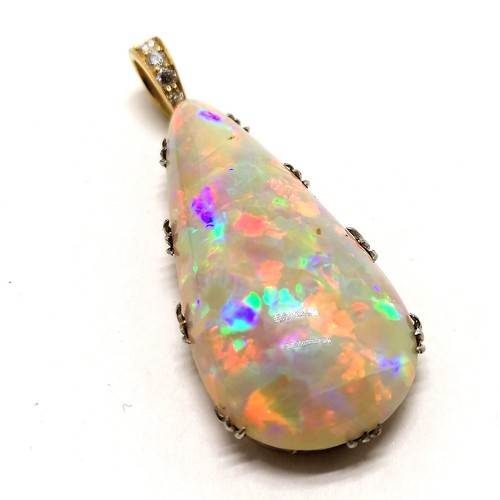 541 - Antique large opal pendant set in unmarked 18ct gold with diamond set bale (4cm drop & 6.4g total we... 