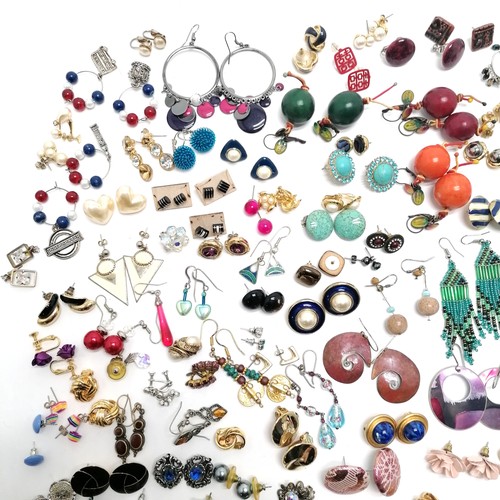 604 - Large qty of costume earrings inc skull, axeheads, gold tone etc - SOLD ON BEHALF OF THE NEW BREAST ... 