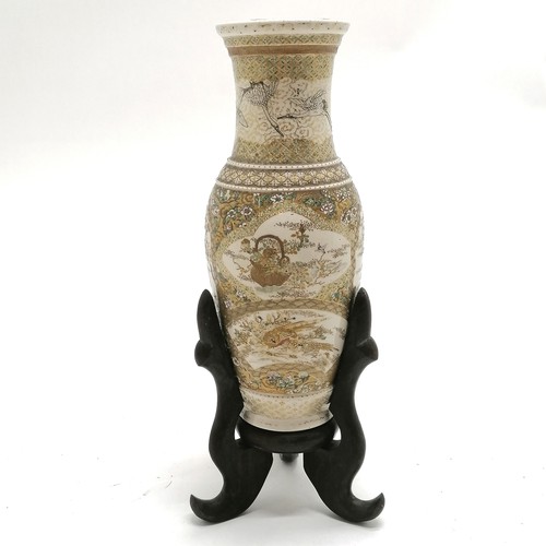 25 - Antique Japanese satsuma vase with profuse decoration on a wooden stand - total height 30cm with wea... 