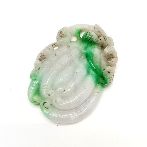 35 - Carved jade scroll weight depicting a bat on a flower signed 9cm x 6cm