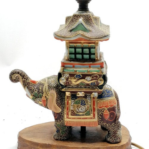 42 - Vintage Japanese satsuma elephant figural lampbase with pagoda detail and has wooden base - 32cm hig... 