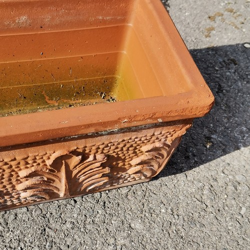 53 - Pair of rectangular terracotta planters with raised leaf motifs - 63cm long - some losses