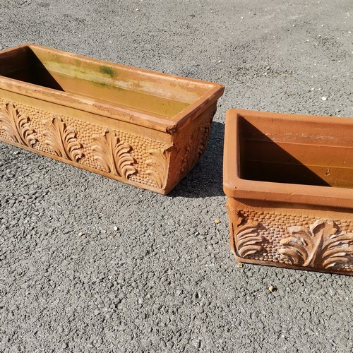 53 - Pair of rectangular terracotta planters with raised leaf motifs - 63cm long - some losses