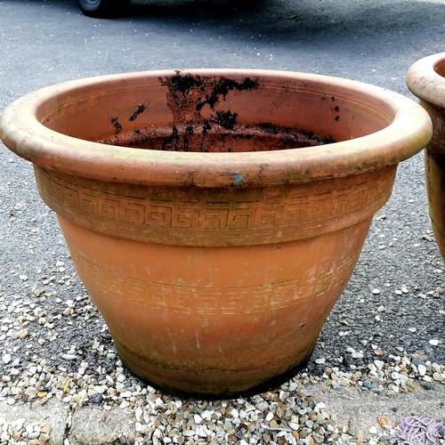 67 - Pair of terracotta planters with geometric patterns - largest 55cm diameter