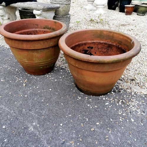 67 - Pair of terracotta planters with geometric patterns - largest 55cm diameter