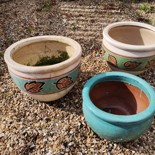 73 - A pair of glazed planters with leaf detail t/w smaller blue glazed pot - largest 25cm high