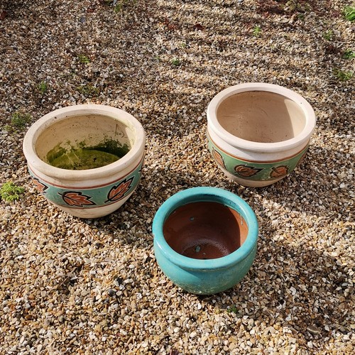 73 - A pair of glazed planters with leaf detail t/w smaller blue glazed pot - largest 25cm high