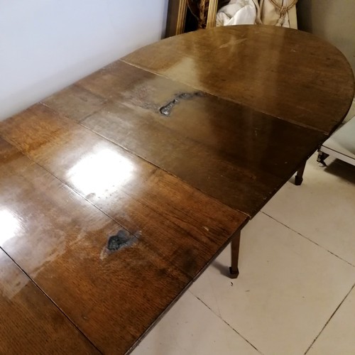 94 - Large antique oak D end dining table with central drop flap table with double swing out leg supports... 