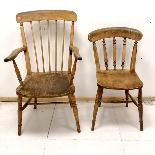 101 - Antique spindle back kitchen armchair T/W an antique kitchen chair - armchair has an old repair to o... 