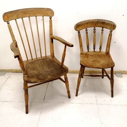 101 - Antique spindle back kitchen armchair T/W an antique kitchen chair - armchair has an old repair to o... 