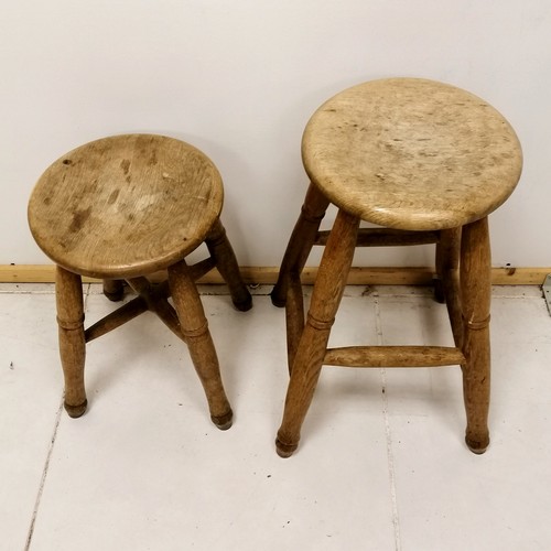 102 - 2  antique circular elm stools - tallest 58cm