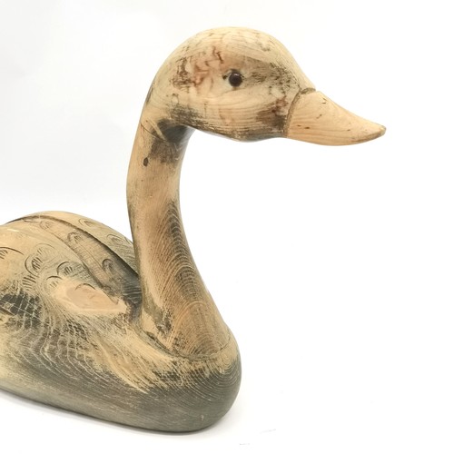 105 - Large carved wooden goose - 31cm high x 49cm long t/w 3 legged milking stool