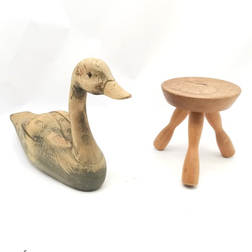 105 - Large carved wooden goose - 31cm high x 49cm long t/w 3 legged milking stool