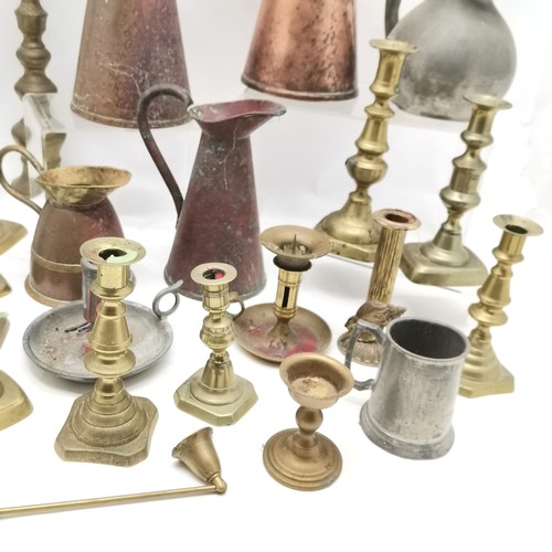 111 - Qty of mostly antique brass candlesticks (inc Georgian) t/w 3 copper jugs (tallest 27cm) etc