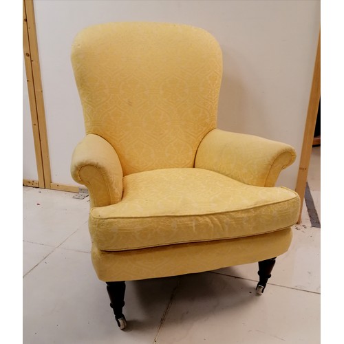 126 - Antique ladies yellow upholstered wing armchair with leather seat cushion- some marks to the fabric