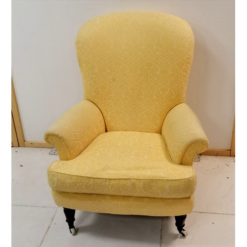 126 - Antique ladies yellow upholstered wing armchair with leather seat cushion- some marks to the fabric