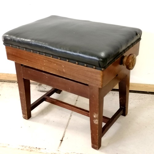 129 - Antique rectangular mahogany adjustable piano stool with black leather upholstered top - has a tear ... 