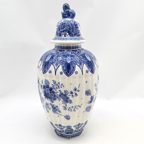 156 - Delft blue and white lidded ribbed vase with peacock decoration & marks to base with lion dog finial... 