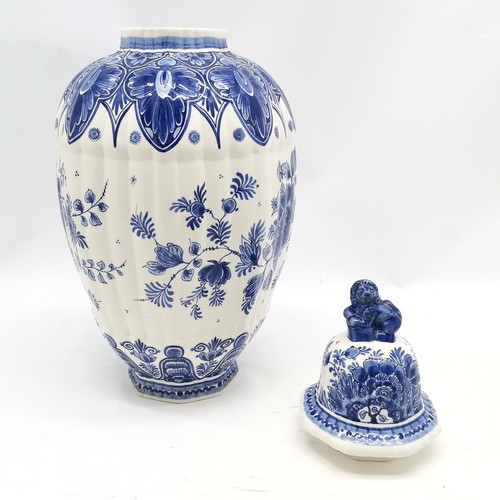 156 - Delft blue and white lidded ribbed vase with peacock decoration & marks to base with lion dog finial... 