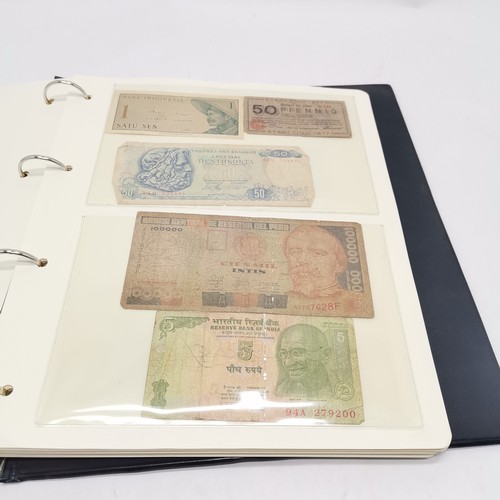 184 - Qty (in 2 albums) of world banknotes ~ approx 200