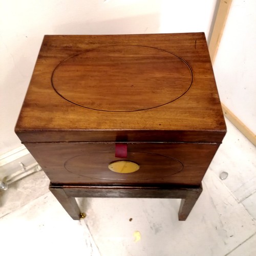 246 - Antique mahogany box with brass fittings and oval inlaid detail on stand terminating on 4 brass cast... 