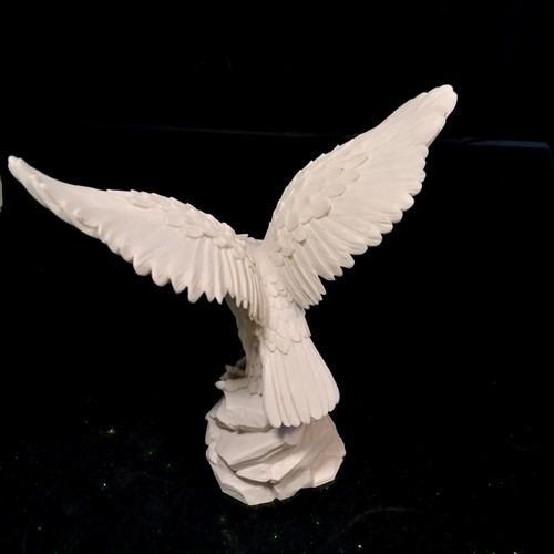 263 - White model of an eagle on a rock - 37cm high x 38cm across