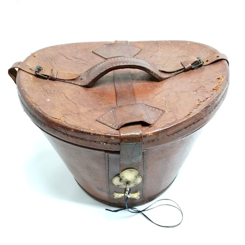 333 - Antique Top hat in it's leather hat box with key 35cm across x 27cm high, top hat by Wheeler & Compa... 