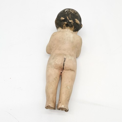 334 - Antique papier mache shop display figure of a child 35cm high - some losses and damage