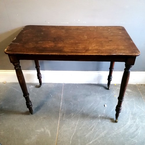 355 - Antique mahogany side table with turned legs terminating on castors - 91cm x 52cm x 73cm high - has ... 