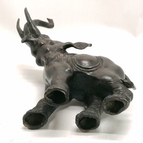 6 - Bronze figure of an elephant with it's trunk raised 32.5cm high x 26cm long - no obvious damage