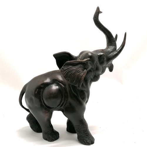 6 - Bronze figure of an elephant with it's trunk raised 32.5cm high x 26cm long - no obvious damage