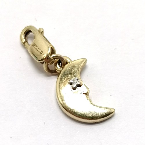 619 - Italian 10ct marked gold crescent moon set with a diamond fob pendant / charm - 2cm drop & 0.9g tota... 